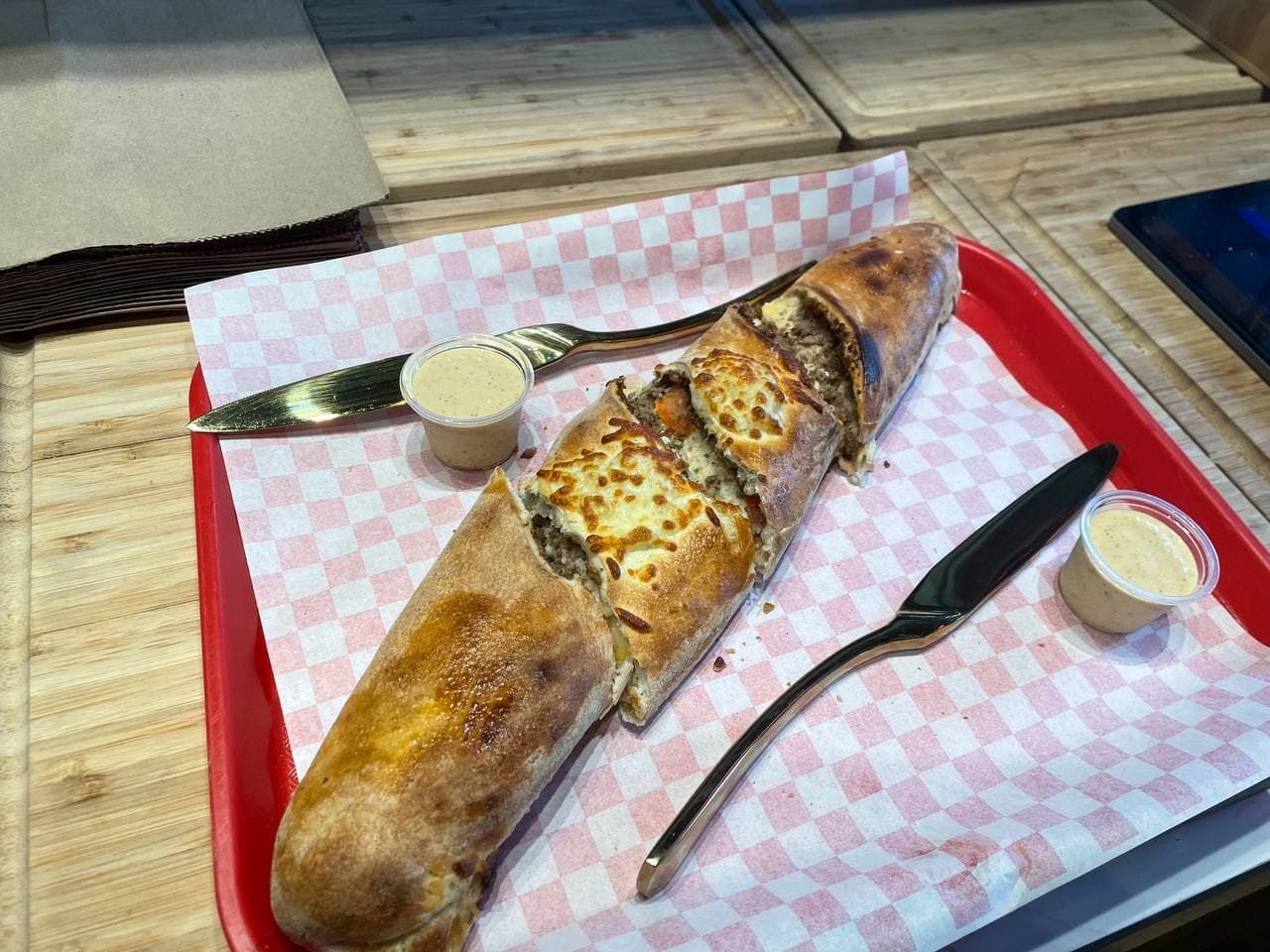 Chicken baguette farcie stuffed with grilled chicken, cheese and harissa mayo